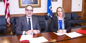 Assistant Attorney General Jonathan Kanter of the Justice Department’s Antitrust Division (left) and Inspector General Christi Grimm (right) sign a memorandum of understanding (MOU) to protect health care markets.