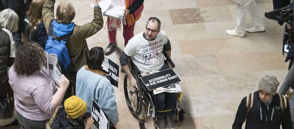 A group of protestors gather for disability rights.