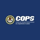 Graphic of the DOJ seal alongside the logo for the Office of Community Oriented Policing Services on a blue background.