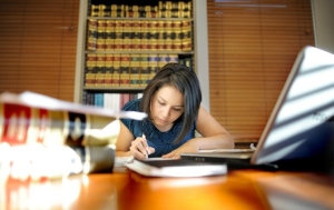 photo of woman studying law books