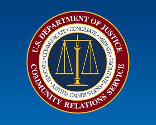 The DOJ Community Relations Service seal image on a blue background.