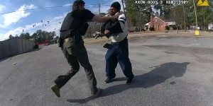 Man pointing gun at officer