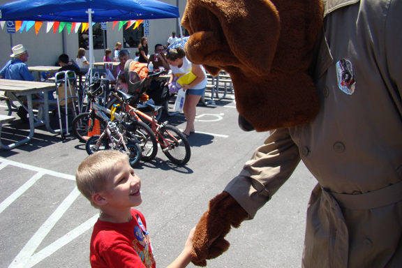 McGruff the crime dog shaking hands with child
